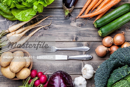 Fresh and organic bio vegetables on a wooden background