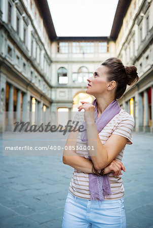 Be inspired by Uffizi Gallery. Young woman tourist sightseeing in Florence, Italy
