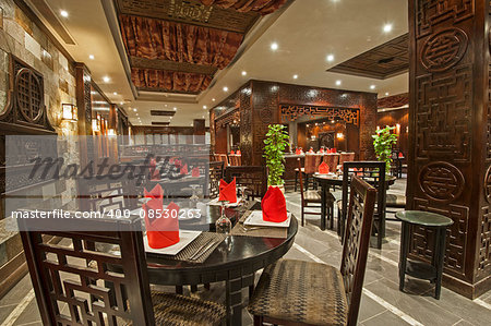 Interior design of a luxury hotel Asian restaurant dining area with ornate decor