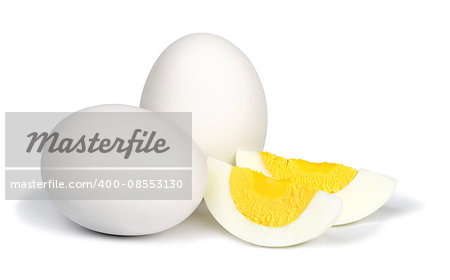 Two whole unpeeled boiled eggs and two slices of eggs isolated on a white background.