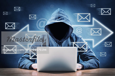faceless man on a computer sending spam mail