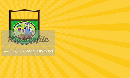 Business card showing illustration of an organic farmer boy wearing hat holding grapes with a bowl of raisins in front of him viewed from front set inside shield crest with sunburst in the background done in retro style.