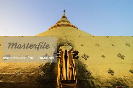 Golden Pagoda with gold elephant at Wat Pra Singh, Chaingmai, Thailand