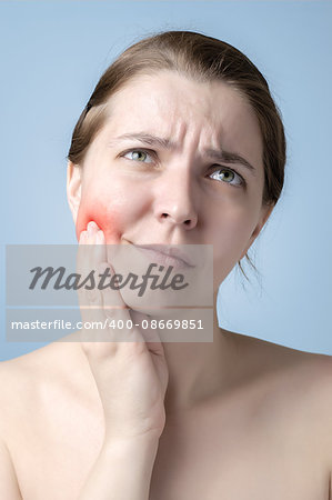 Young woman suffering from toothache