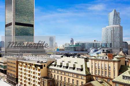 Old residences and modern office buildings at Warsaw city center.