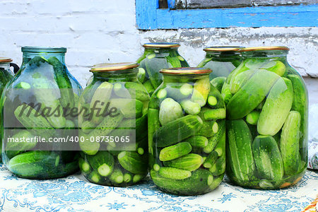ripe cucumbers are washed in the water before preservation