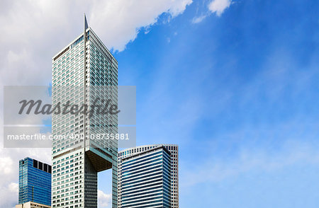 Top of modern skyscrapers and blue sky, copy space.