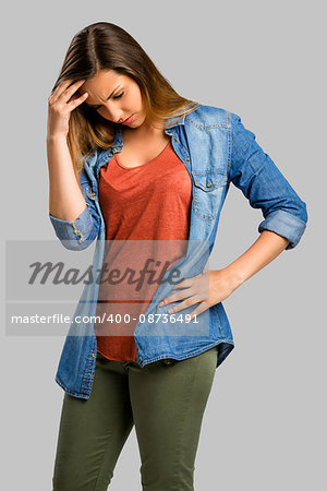 Beautiful woman with hands on head worried with something