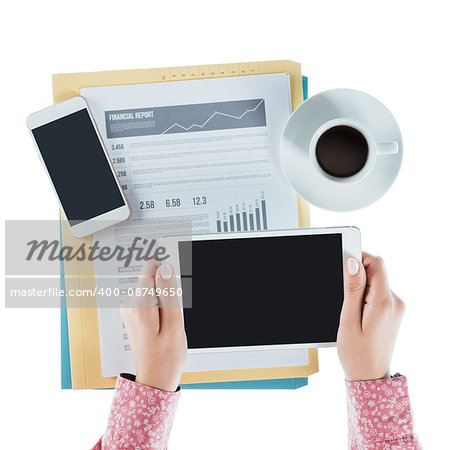 Business woman working at desk and using a digital tablet, hands close up, top view