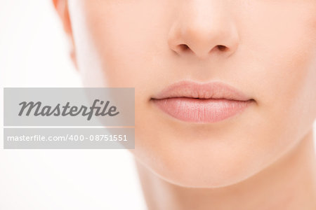 Beautiful young woman's full lips close-up, perfect skincare concept