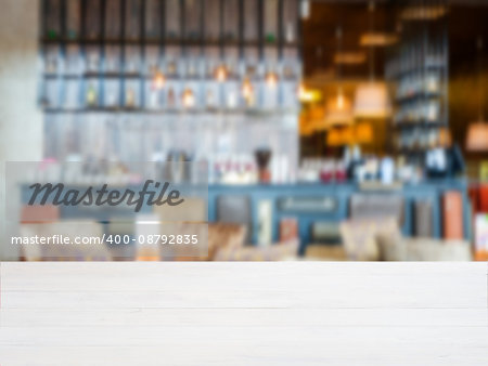 White wooden board empty table in front of blurred background. Perspective whitewood over blur in cafe interior - can be used for display or montage your products. Mockup your products