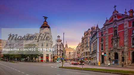 Panoramic cityscape image of Madrid, Spain during sunrise.