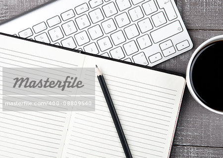 Keyboard with pencil and  coffee cup on office desk