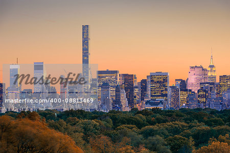 New York City skyline over Central Park in early autumn.