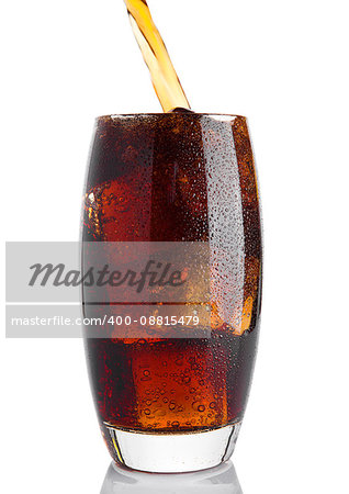 Pouring cola soda drink into the glass with ice on white background