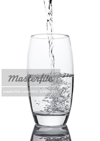 Pouring cold fresh healthy still water to glass on white background