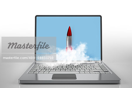 Small rocket flying from the screen of a laptop. Startup working enterprise concept. mixed media