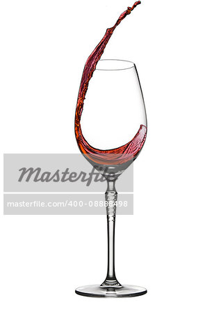 Pouring wine to elegant wine glass with splash on white background