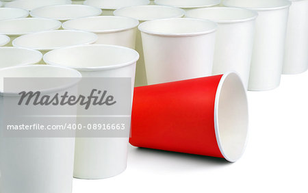 One different unique red paper cup among white ordinary cups lined up diagonally. Concept.