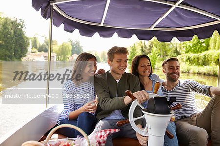 Friends Taking Selfie During Boat Ride On River Together