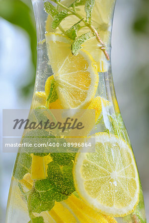 Fresh limes and lemonade in bottle