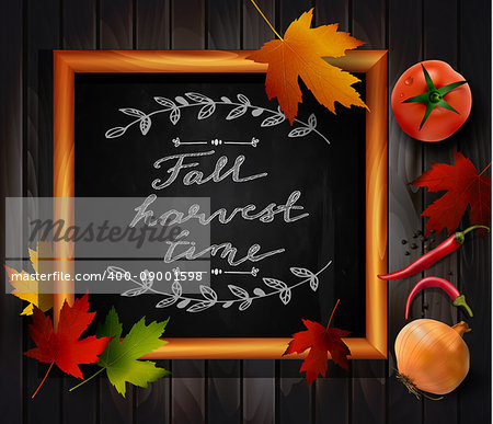 Chalkboard with autumn leaves and cup of coffee chili pepper onion and tomato