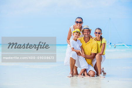 Happy family having fun on tropical beach