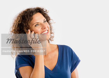 Beautiful young woman with mobile phone making a phone call