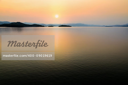 Beautiful landscape lake island and mountain range at sunset on the Kaeng Kra Chan Dam view point in  National Park, Phetchaburi Province, Thailand