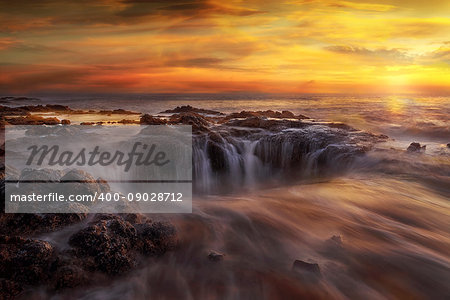 Thors Well at Cooks Chasm by Cape Perpetua on the Oregon Coast during a fiery unset