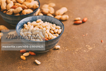 Peanuts in bowls wiht copy space. Toned image