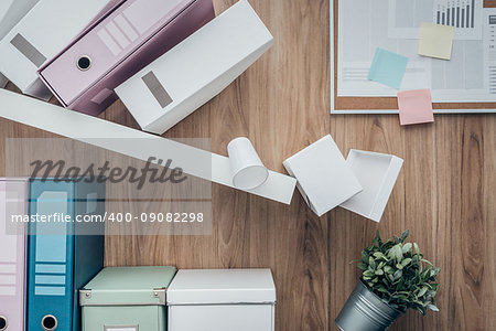 Office shelf crashing and folders falling down, failure and disaster concept