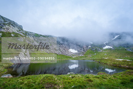 Beautiful mountain lake on the hiking route to Kjerag stone. Norway nature landscape.