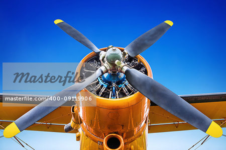 propeller of an historic airplane against a blue sky