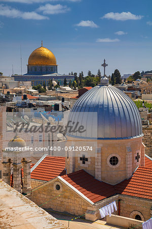 Cityscape image of old town Jerusalem, Israel with the Church of St. Mary of agony and the Dome of the Rock.