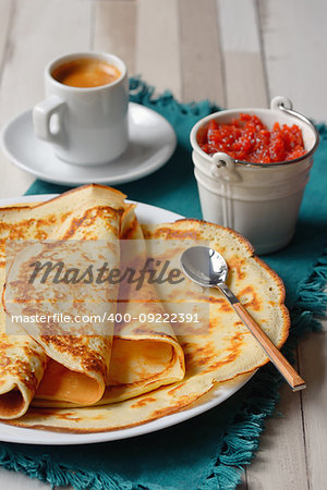 Breakfast with pancakes, jam and coffee