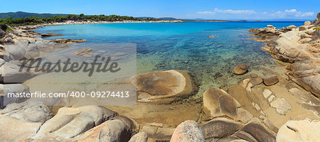 Aegean sea coast view and Karidi or Karydi beach (Chalkidiki, Greece). Two shots stitch panorama. People are unrecognizable.