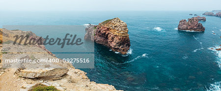 Rock formations near shore. Summer Atlantic rocky coast view (Costa Vicentina, Algarve, Portugal).