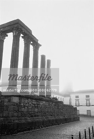 Column Ruins near Buildings, Evora, Portugal