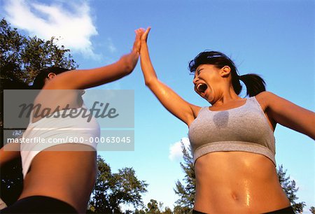 Two women giving high five hi-res stock photography and images - Alamy