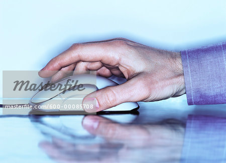 Close-Up of Hand Using Computer Mouse