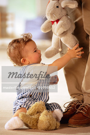 Toddler Playing with Stuffed Toys