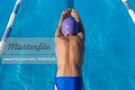 Boy Diving into Swimming Pool