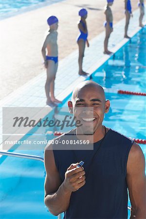 Portrait of Coach by Swimming Pool