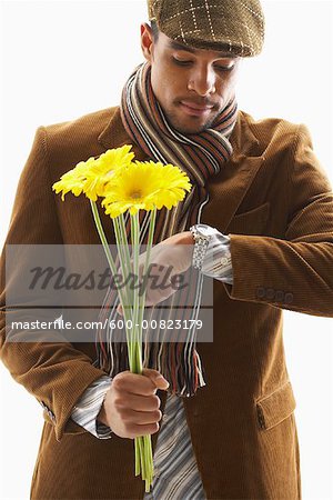 Portrait of Man Holding Flowers and Checking the Time