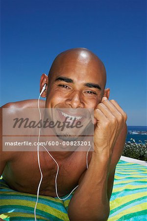 Man Listening To Music At Poolside