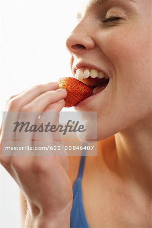 Woman Eating Strawberry