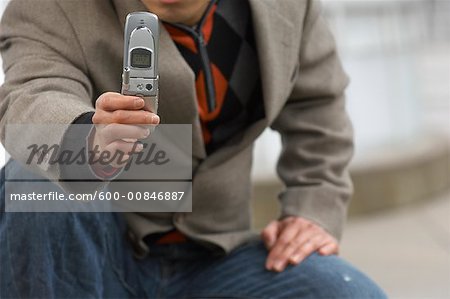 Man Taking Photo With Cell Phone