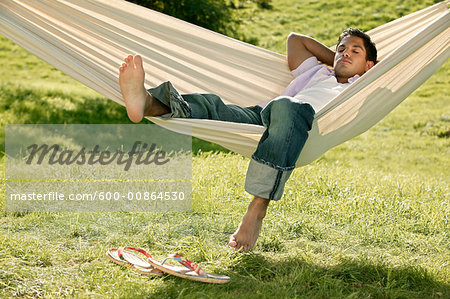 Man Sleeping in Hammock