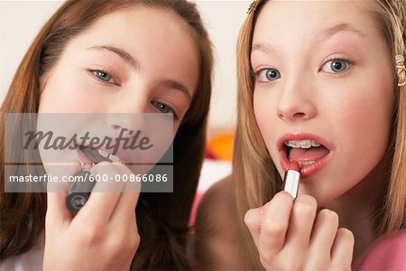 Girls Applying Lipstick